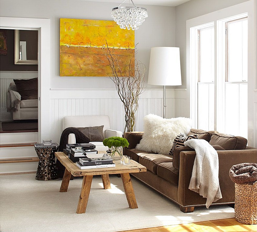 White walls balance rustic textures. Design by Urratia Design.