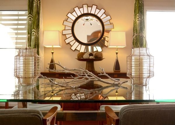 A branch placed on a console table adds a fall flavor to rooms.