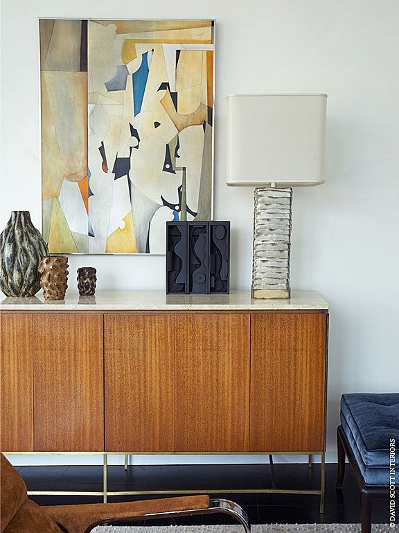 This sideboard, pictured in a room done by David Scott Interiors, is a classic mid-century piece.