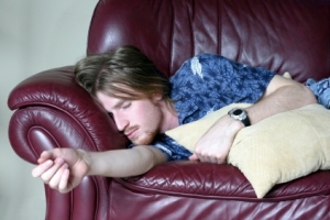 Lazy guy sleeping on couch