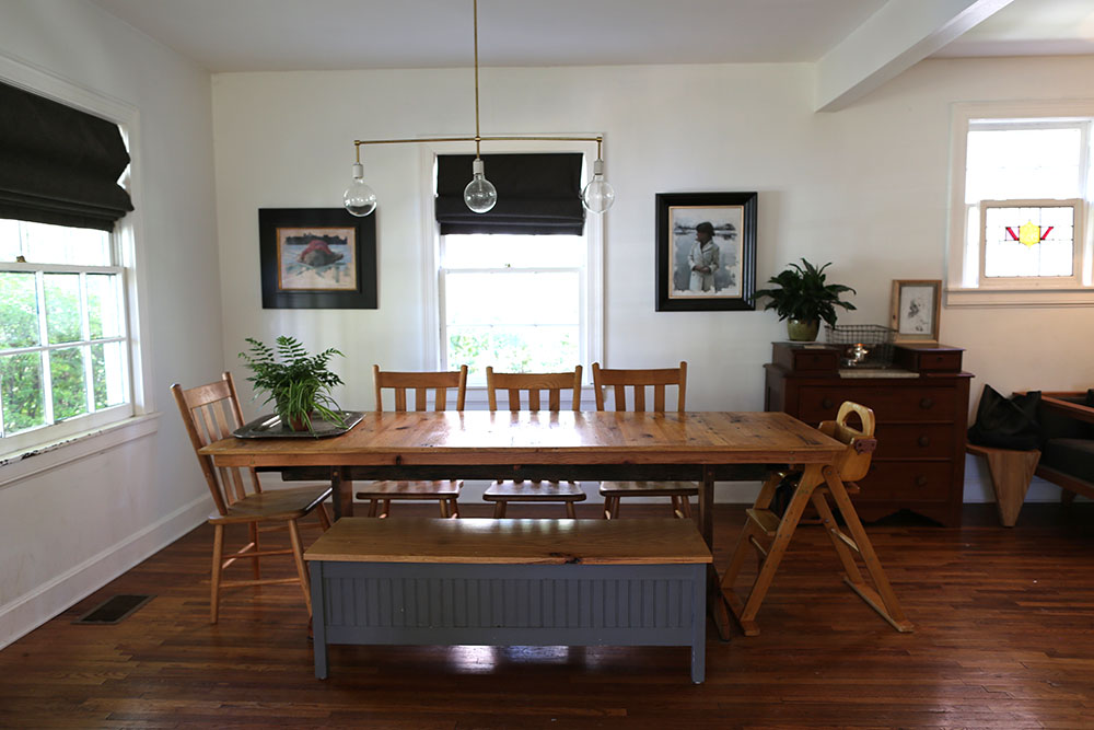 The McLeods' dining room table is made of reclaimed tongue-and-groove flooring. 