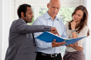 Entrepreneurs Looking at a Binder