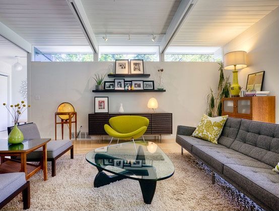This room layers designs -- including those with a mid-century modern influence -- to create this living room.