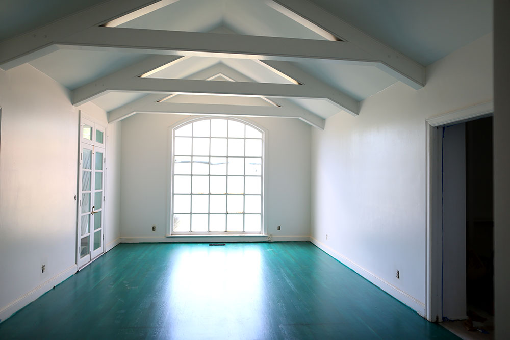 Turquoise-stained floors are a fun nod to the colors of the 1970s.