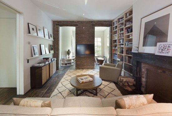 A white rugs contrasts nicely against a wood floor.