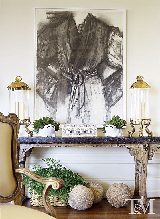 Unusual planters make liven up the table in this entryway.